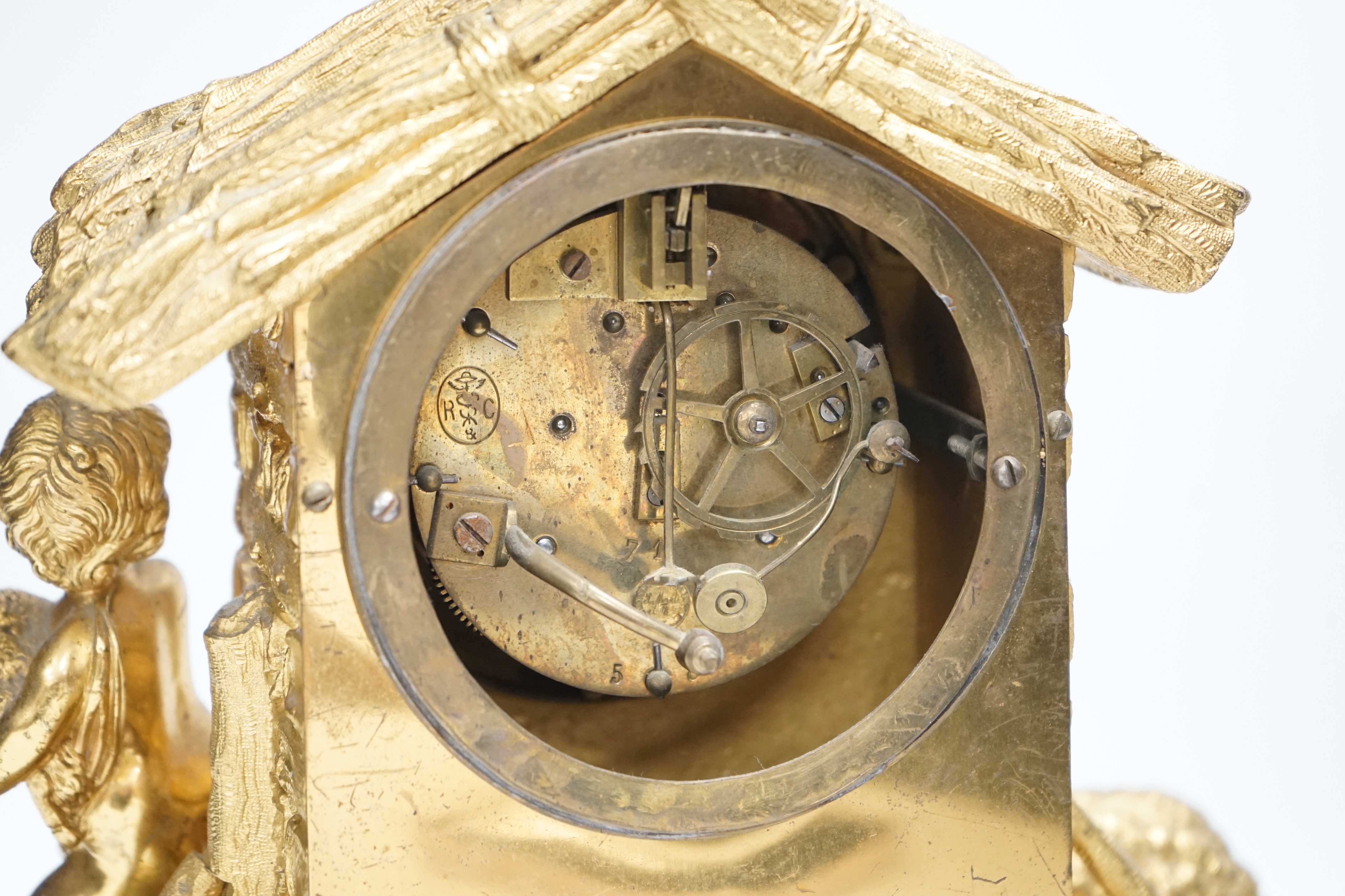 A 19th century ormolu clock, Richard & Cie stamped movement, case formed as a log cabin with child and sheep figural group, 30cm high